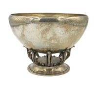 Georg Jensen silver bowl of Art Deco design with spot hammered decoration on scroll supports and cir
