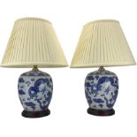 Pair of blue and white ovoid form table lamps