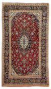 Persian Kashan crimson ground rug