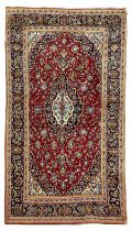 Persian Kashan crimson ground rug