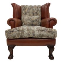 Traditionally shaped wingback club armchair