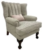 Traditionally shaped wingback armchair
