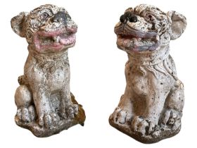 Pair of cast stone garden ornaments in for form of Dogs of Fo