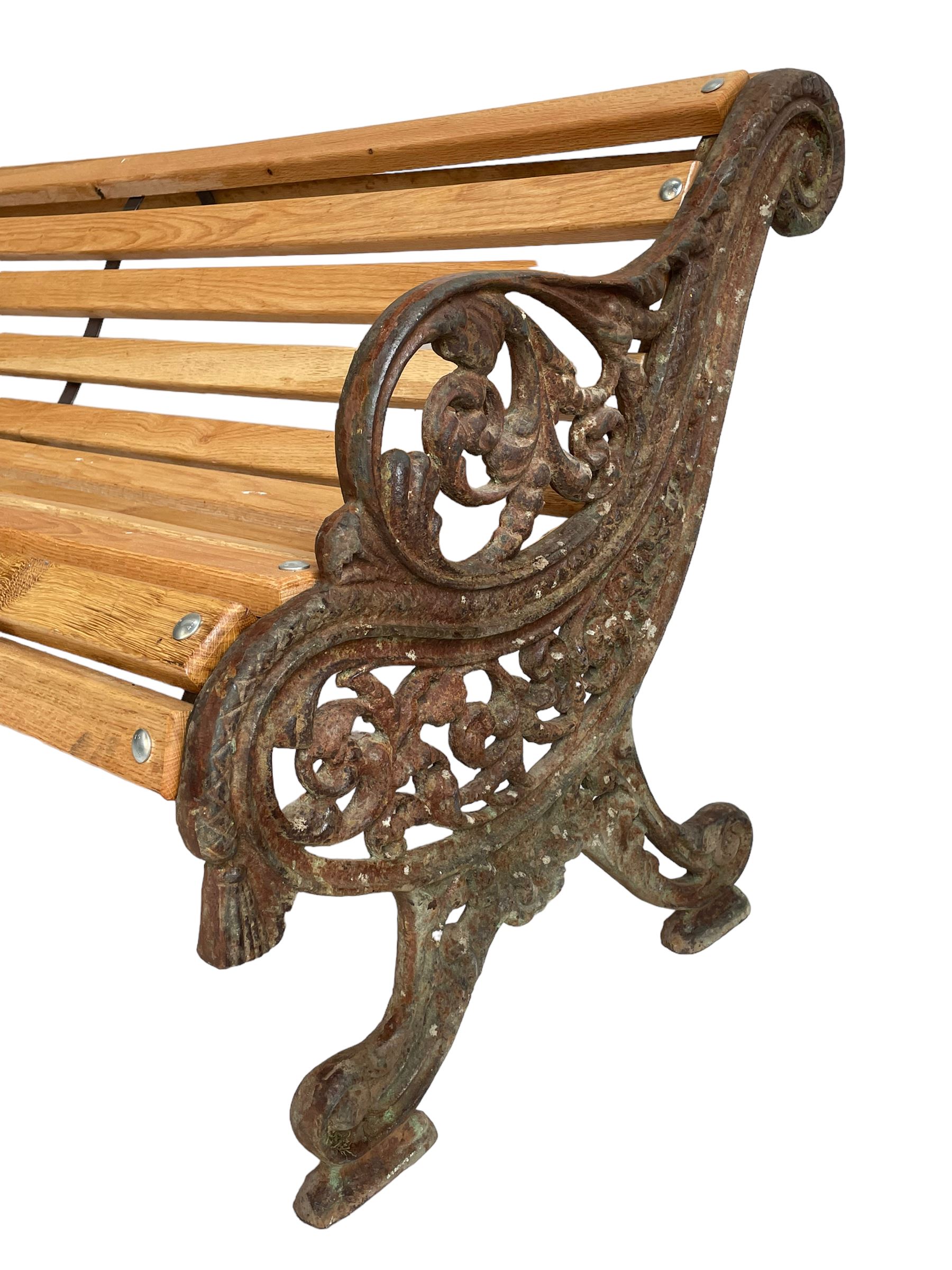 Victorian cast iron and oak slatted garden bench - Image 5 of 11