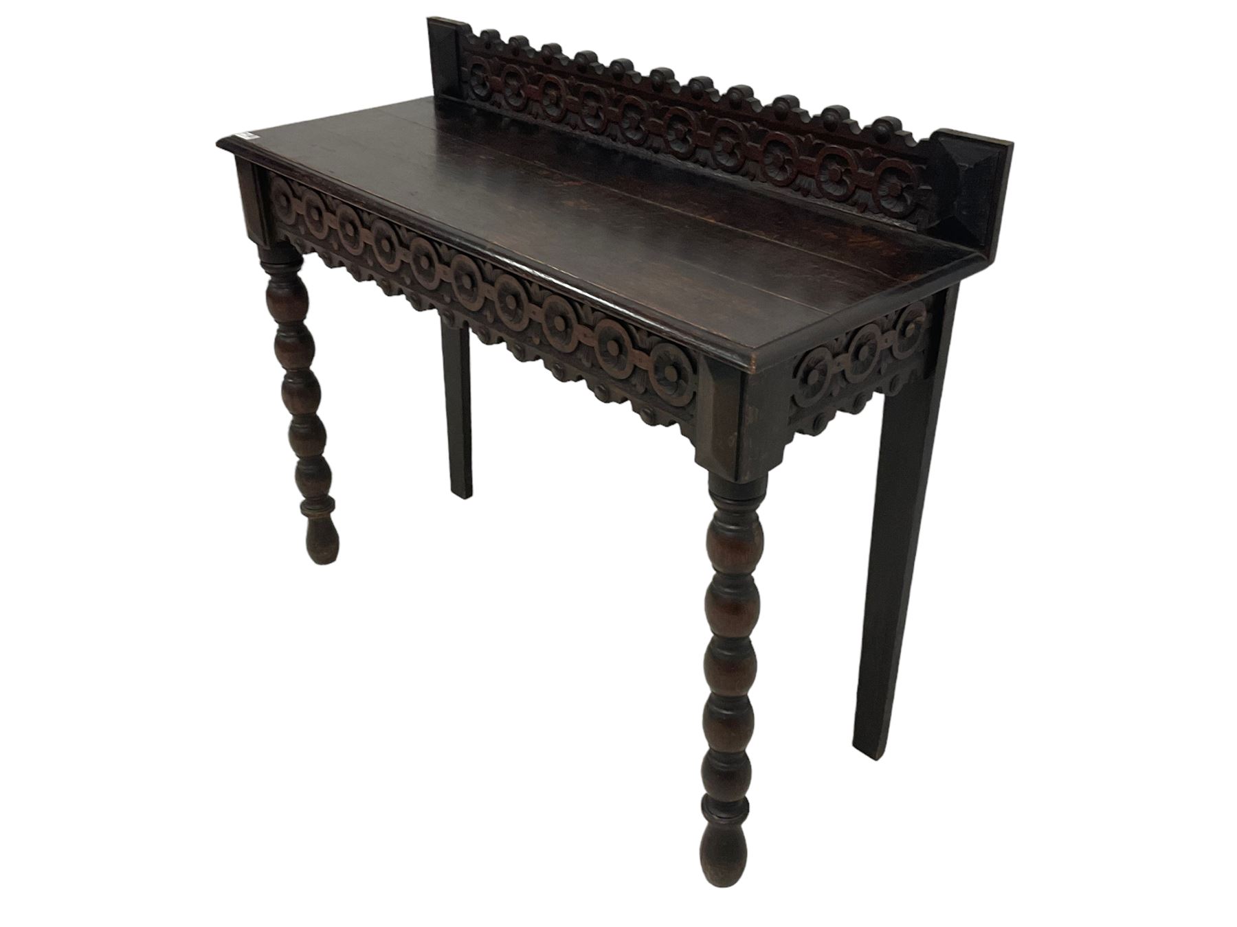 Late 19th century gothic revival oak side table the raised back carved with repeating rosette and fl - Image 4 of 5