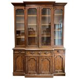 A. Blain & Son Liverpool - mid-to Late Victorian figured mahogany break-front bookcase on cupboard