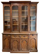 A. Blain & Son Liverpool - mid-to Late Victorian figured mahogany break-front bookcase on cupboard