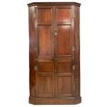 George III stained pine double corner cupboard