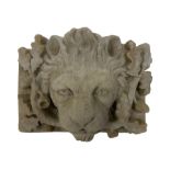 Composite stone wall plaque of a lion mask