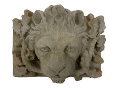 Composite stone wall plaque of a lion mask