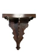 Victorian - late 19th century mahogany wall bracket with a wavy apron to the front and sides