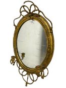 Victorian oval wall mirror with two candle sconces in a gilt frame with rope twist decoration