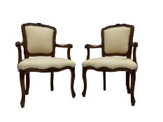 Pair Louis XVI design walnut framed salon armchairs