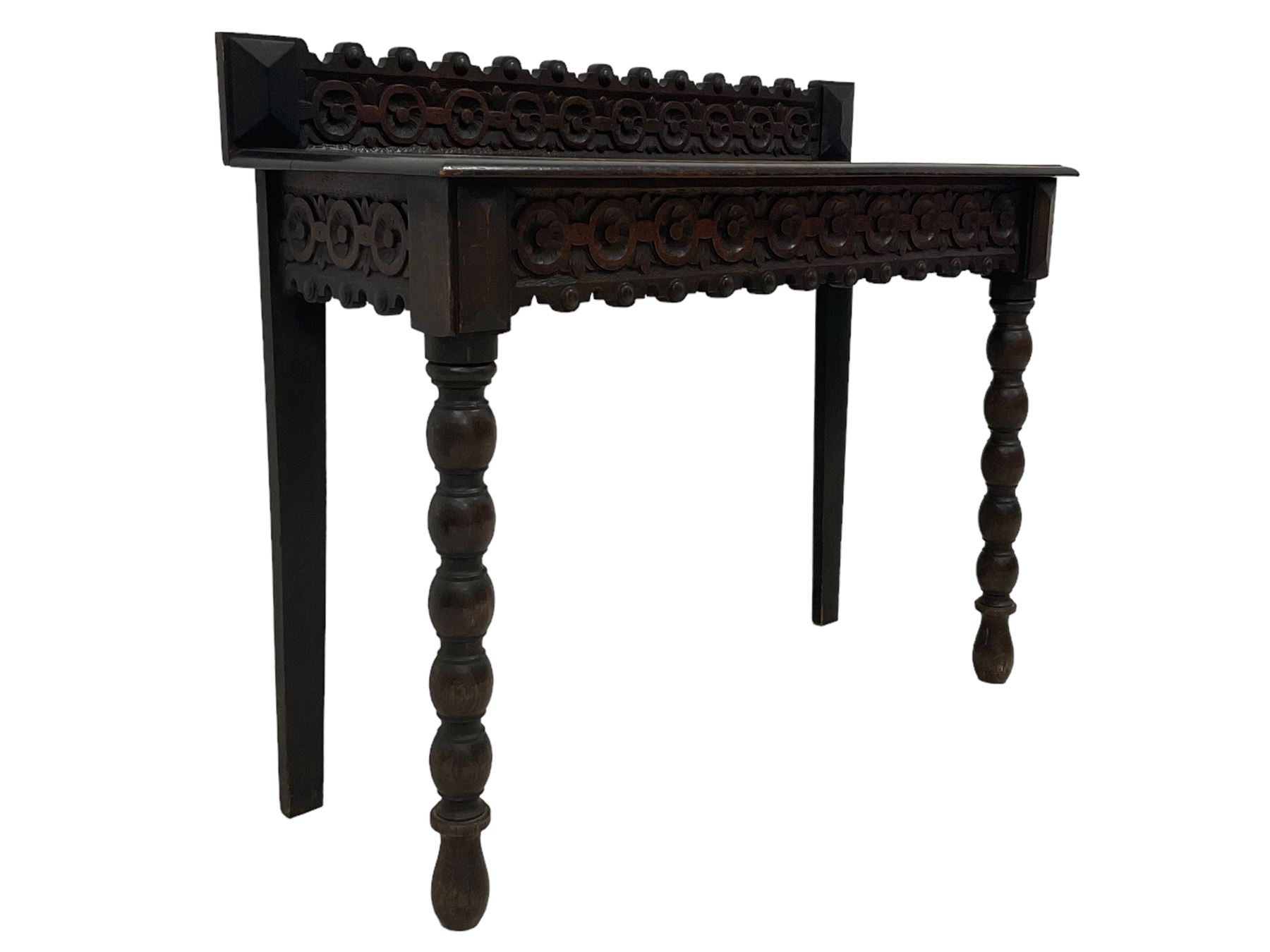 Late 19th century gothic revival oak side table the raised back carved with repeating rosette and fl - Image 3 of 5