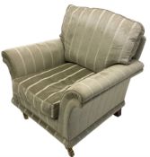 Traditional shaped armchair with scrolled arms