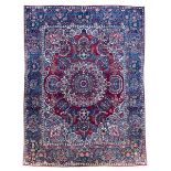 Antique Persian crimson ground carpet