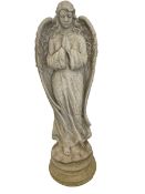Composite stone garden figure modelled as a winged praying angel