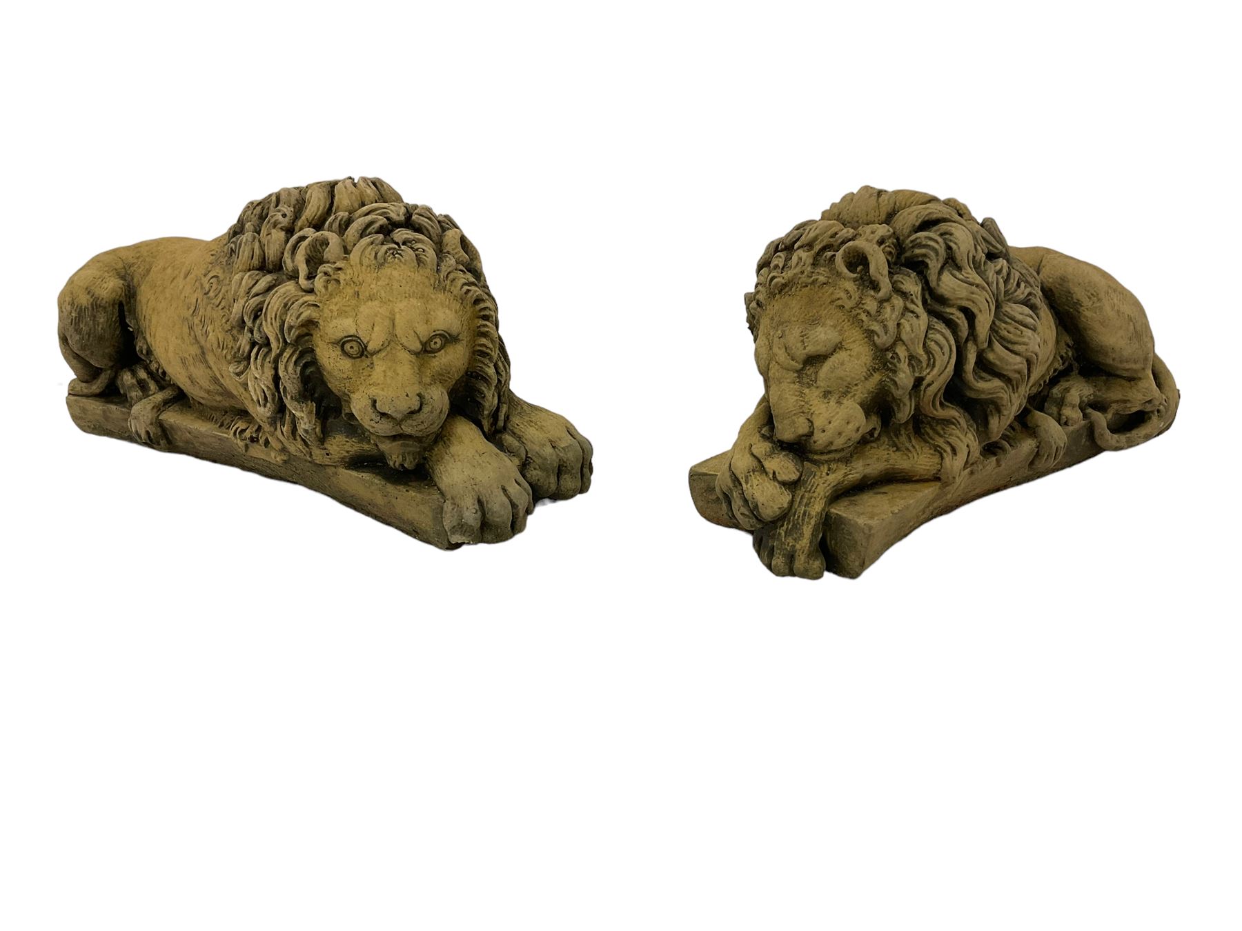 Near pair constituted stone garden or indoor ornaments in the form of recumbent lions