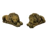 Near pair constituted stone garden or indoor ornaments in the form of recumbent lions