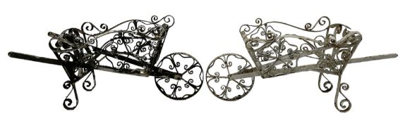 Pair early 20th century wrought metal planters in the form of wheelbarrows