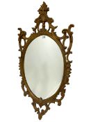 Ornate oval gilt frame wall mirror