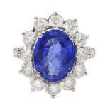 18ct white gold oval sapphire and round brilliant cut diamond cluster ring