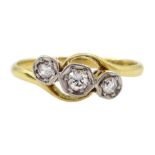 Early 20th century three stone old cut diamond crossover ring