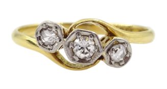 Early 20th century three stone old cut diamond crossover ring