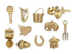 Eleven 9ct gold charms including gardening fork
