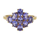 9ct gold oval tanzanite and baguette cut diamond cluster ring