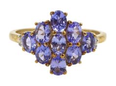 9ct gold oval tanzanite and baguette cut diamond cluster ring