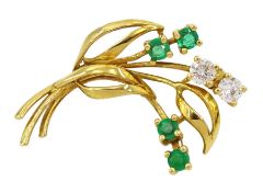 18ct gold round cut emerald and round brilliant cut diamond flower brooch