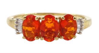 9ct gold three stone oval fire opal and baguette diamond ring