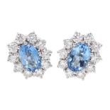 Pair of 18ct white gold oval aquamarine and round brilliant cut diamond cluster stud earrings