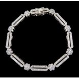 Silver cubic zirconia flower and oval link bracelet