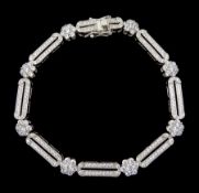 Silver cubic zirconia flower and oval link bracelet