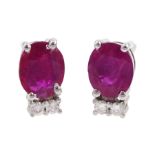 Pair of 18ct white gold oval ruby and diamond stud earrings