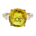 18ct gold three stone yellow sapphire and round brilliant cut diamond ring