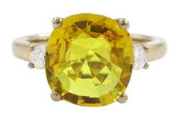 18ct gold three stone yellow sapphire and round brilliant cut diamond ring
