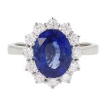 18ct white gold oval cut sapphire and round brilliant cut diamond cluster ring