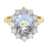 18ct gold oval aquamarine and round brilliant cut diamond cluster ring