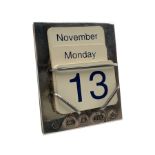 Silver perpetual calendar with a complete set of date and month cards