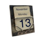 Silver perpetual calendar with a complete set of date and month cards