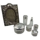 Embossed silver upright table photograph frame with oval aperture 12cm x 9cm Birmingham 1912