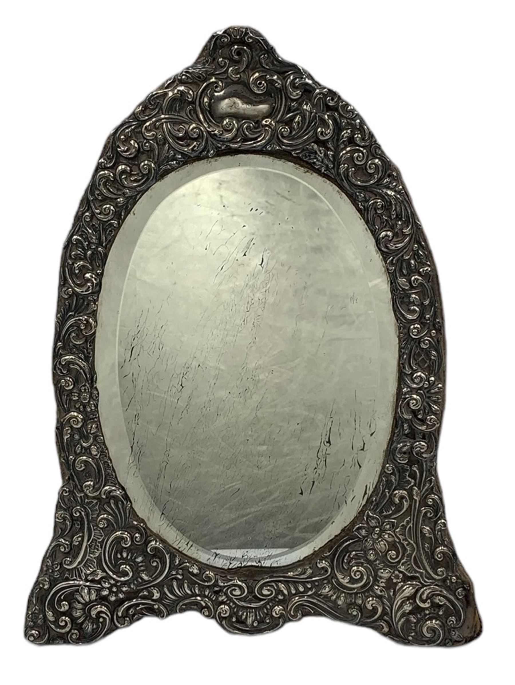 Edwardian silver frame dressing table mirror with oval bevelled plate and embossed frame on easel st