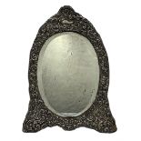 Edwardian silver frame dressing table mirror with oval bevelled plate and embossed frame on easel st