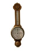 The Wilson Forecast Barometer - 20th century oak cased aneroid barometer with a white dial reading a