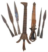 Indonesian Kris with waved steel blade with carved animal head grip and wooden scabbard