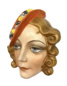 Art Deco Czech wall mask modelled as a lady wearing an orange hat