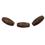 Three Tibetan Dzi stone beads each with decorative symbols approx 3cm long